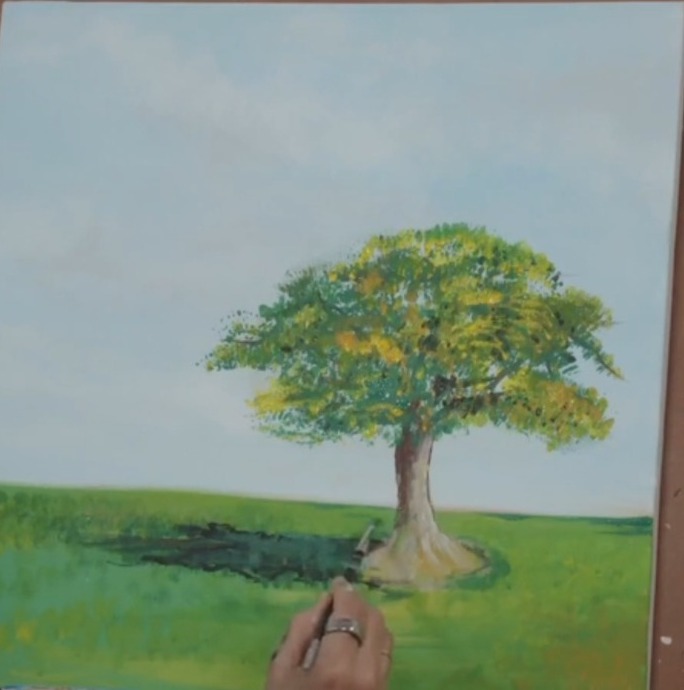Finished painting of a leafy oak tree in a sunny green meadow